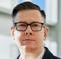 Alexander Hughes, CEO di un'azienda specializzata nel trading di criptovalute, ritratto
